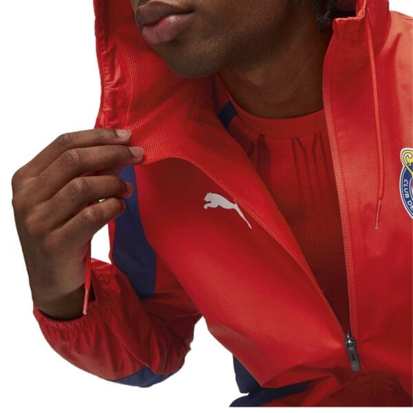 Red and blue Puma jacket with zipper.