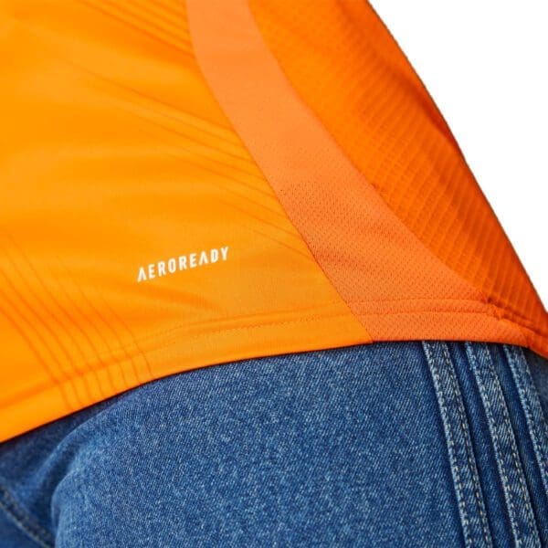 Orange shirt with Aeroready logo.