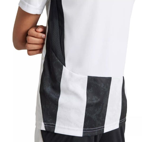 White and black striped soccer jersey.