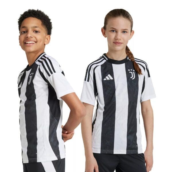 Two children wearing Juventus soccer jerseys.