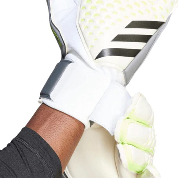 White and black Adidas goalkeeper gloves.