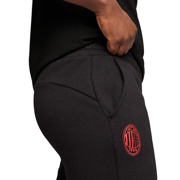 Black sweatpants with AC Milan logo.