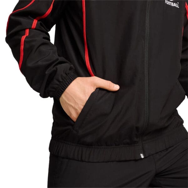 Black jacket with red trim and zipper.