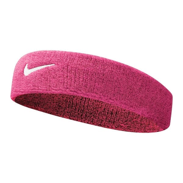 Pink Nike headband with white swoosh logo.