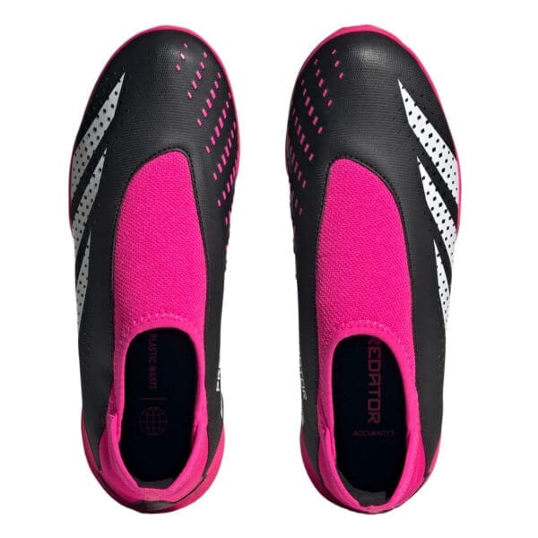 Black and pink Adidas Predator soccer shoes.