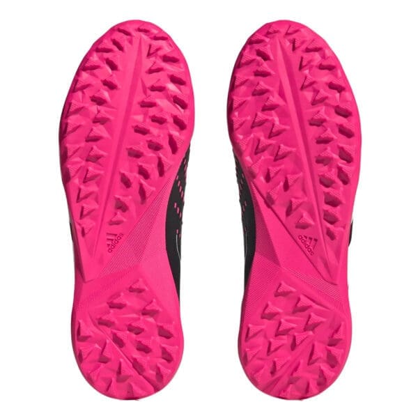 Pink and black Adidas shoe soles.