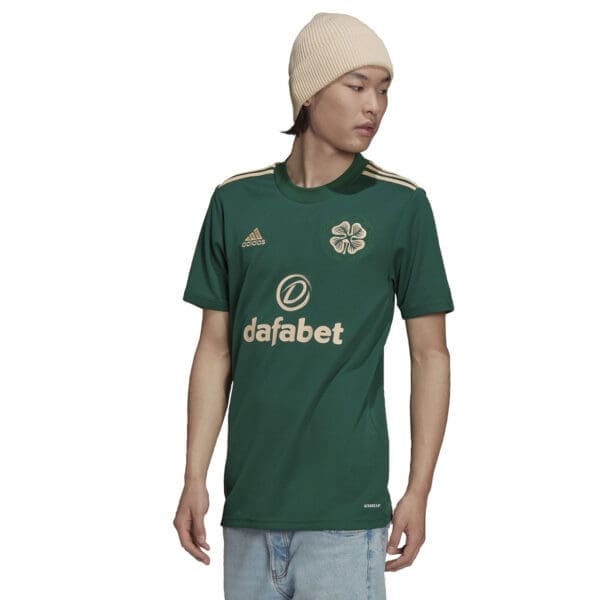 Man wearing green Adidas Celtic FC jersey.