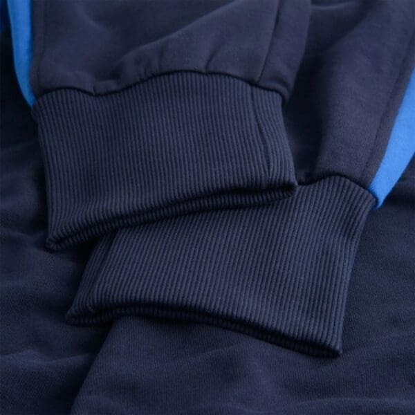 Close-up of navy blue ribbed fabric.