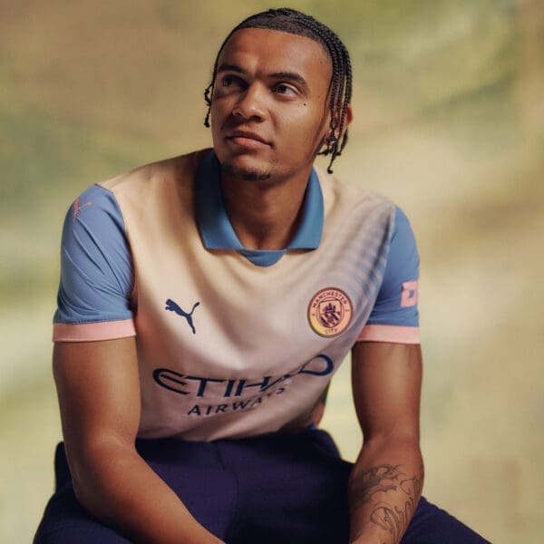 Man City player wearing a new jersey.