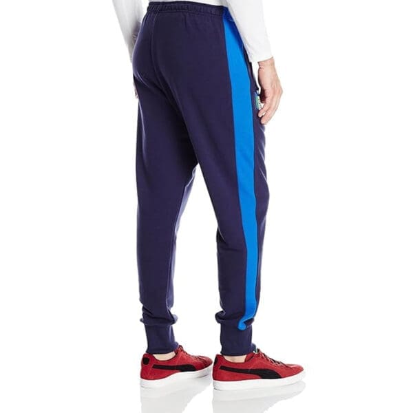 Man wearing blue sweatpants with blue stripe