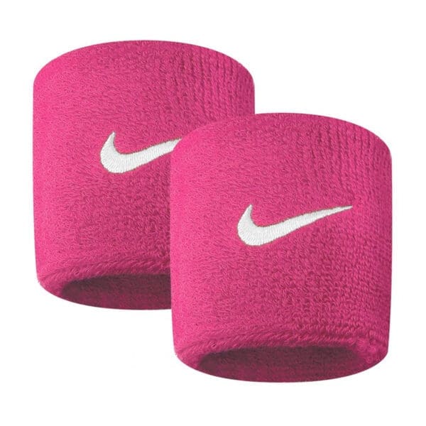 Pink Nike wristbands with white swoosh logo.