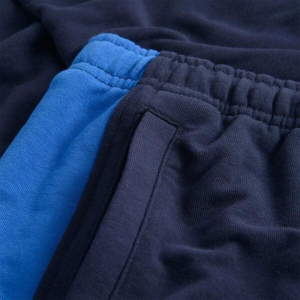 Blue and navy blue sweatpants fabric.