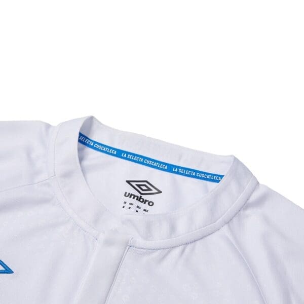 White soccer jersey with Umbro logo.