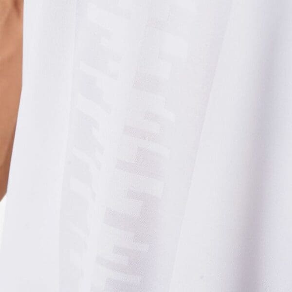 White shirt with embossed logo.