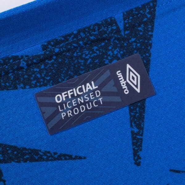 Umbro official licensed product tag.