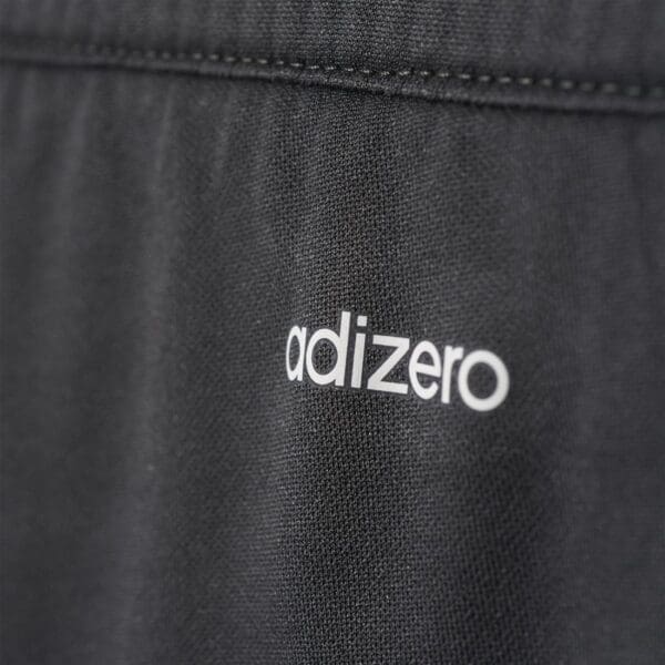 Adidas adizero logo on black fabric.