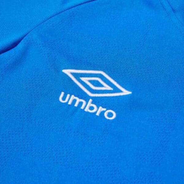 Blue shirt with white umbro logo.