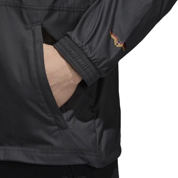 Black Adidas windbreaker with pocket detail.