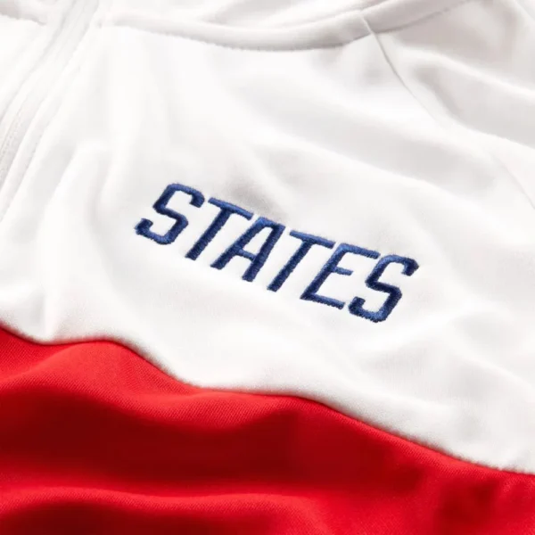 White and red jacket with "STATES" embroidered.