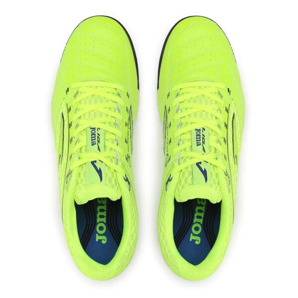 Yellow Joma brand indoor soccer shoes.