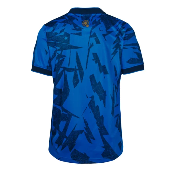 Blue soccer jersey with abstract pattern.