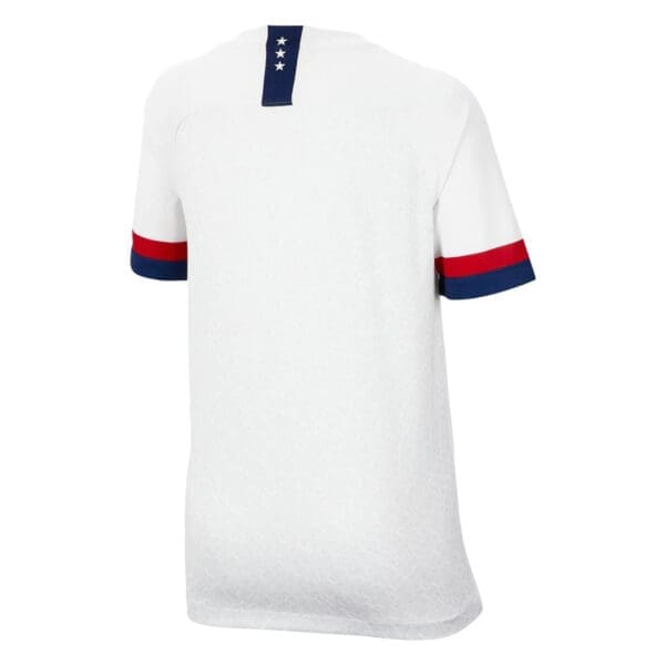 White soccer jersey with red and blue accents.