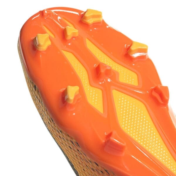 Orange and yellow soccer cleat sole.