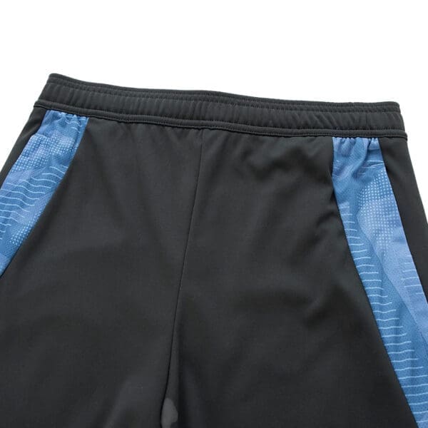 Black athletic pants with blue stripes.