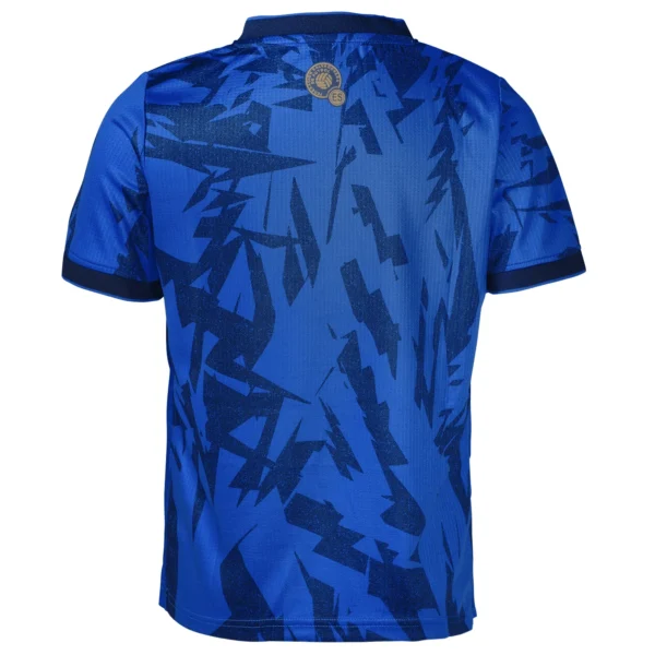 Blue soccer jersey with abstract pattern.