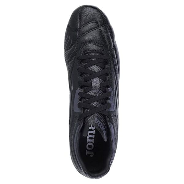 Black leather Joma soccer shoe, top view.