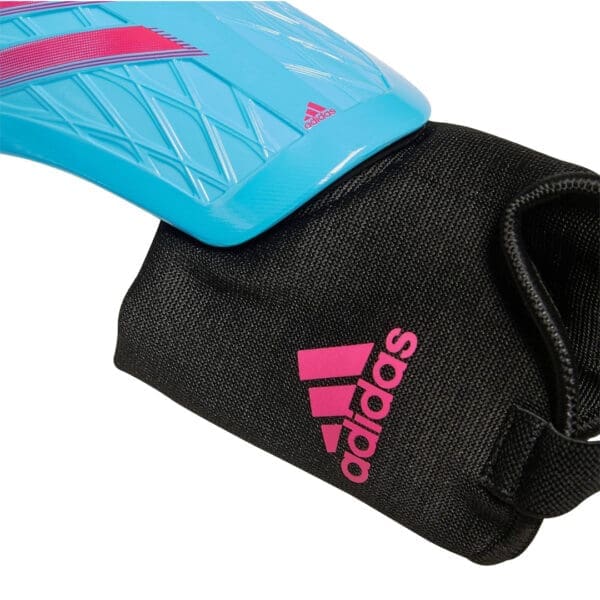 Blue and pink Adidas shin guards.