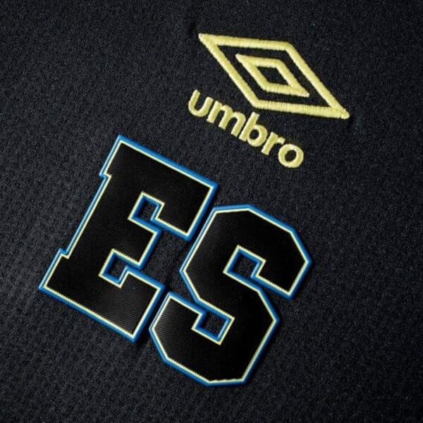 Black soccer jersey with "ES" logo.