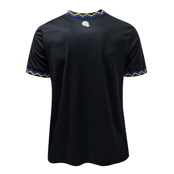 Black soccer jersey with yellow and blue trim.