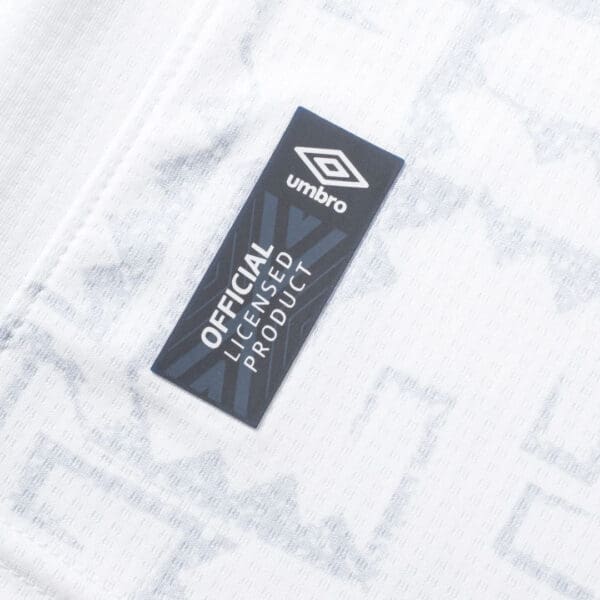 Umbro official licensed product tag.