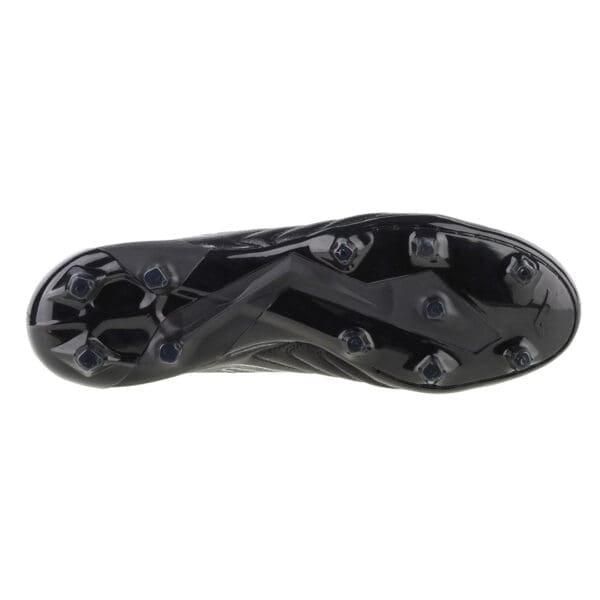 Black leather soccer cleat bottom view.