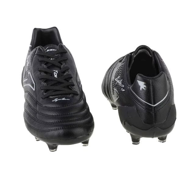 Black leather soccer cleats with signature.