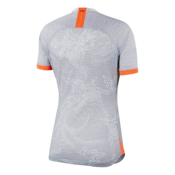 China women's soccer jersey, white with orange accents.