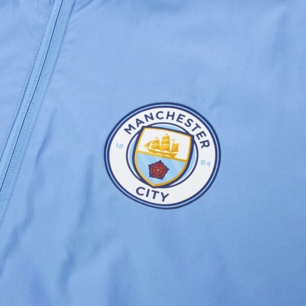 Manchester City blue jacket with logo.