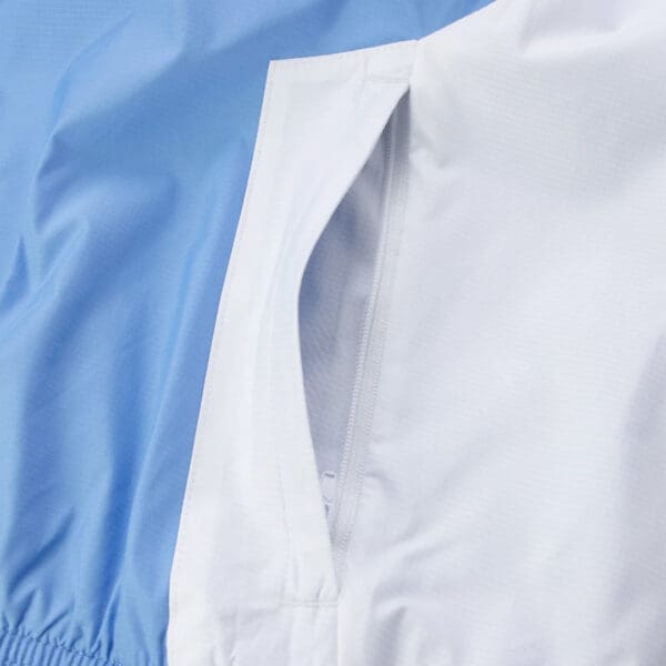 White and blue jacket with pocket.