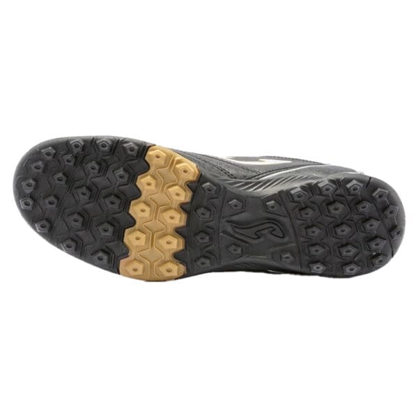 Black and gold soccer shoe sole.