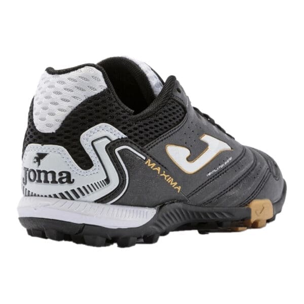 Black and white Joma Maxima soccer shoe.