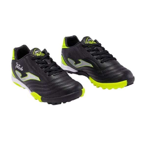 Black and yellow soccer cleats.