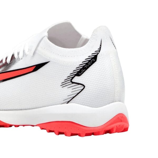 White and red Puma Ultra soccer shoe.