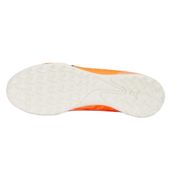 Orange and white Puma soccer shoe sole.