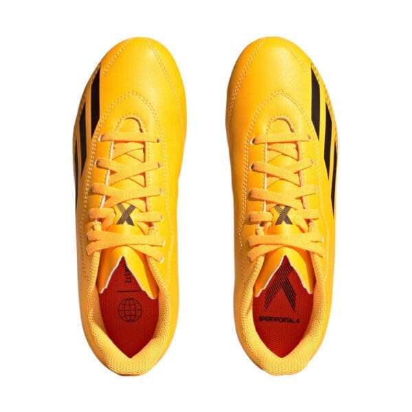 Yellow Adidas soccer cleats with black stripes.