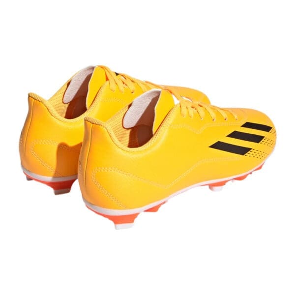 Yellow Adidas soccer cleats with black stripes.