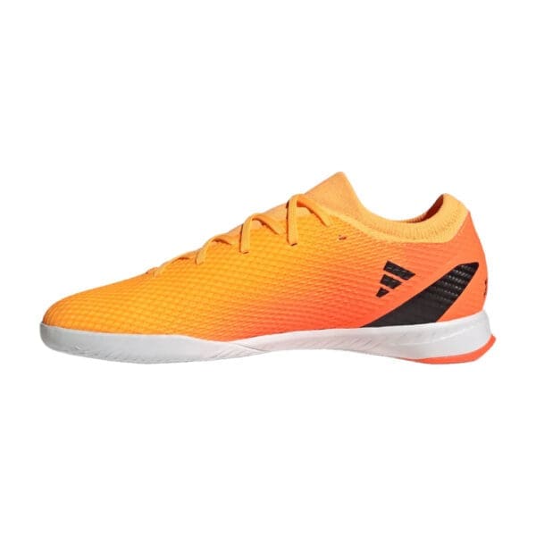 Orange and black Adidas indoor soccer shoe.