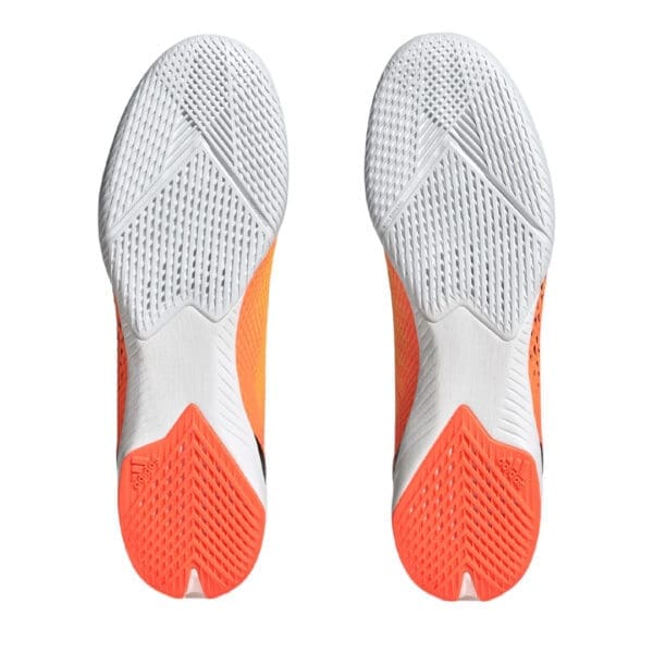 Orange and white Adidas shoe soles.