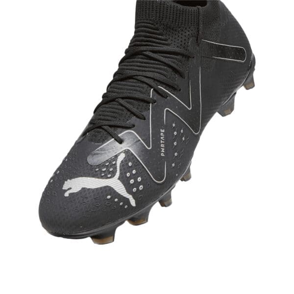 Black Puma soccer cleats with white logo.