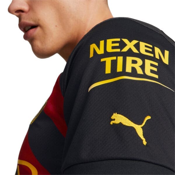 Black Puma soccer jersey with Nexen Tire logo.